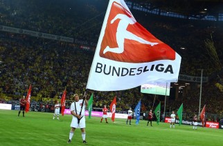 DORTMUND, GERMANY - AUGUST 24: A volunteer waves a flag othe the DFL during the Bundesliga match between Borussia Dortmund and Werder Bremen at Signal Iduna Park on August 24, 2012 in Dortmund, Germany. (Photo by Christof Koepsel/Bongarts/Getty Images)